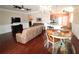 Open-concept living and dining area with hardwood floors, chandelier, and connection to the kitchen at 8320 Sw 82Nd Loop, Ocala, FL 34481