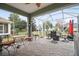 Relaxing screened patio with seating area, fire pit, and backyard views at 8320 Sw 82Nd Loop, Ocala, FL 34481