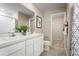 Double vanity bathroom with a shower and separate toilet area at 2302 Incandescent Way, South Daytona, FL 32119