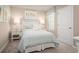 Bright bedroom with light walls and a comfortable bed at 2302 Incandescent Way, South Daytona, FL 32119