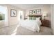 Spacious primary bedroom with a king-size bed and neutral decor at 2302 Incandescent Way, South Daytona, FL 32119
