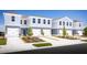Two-story townhouses with attached garages and landscaping at 2302 Incandescent Way, South Daytona, FL 32119