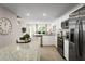 Modern kitchen with stainless steel appliances and granite countertops at 2302 Incandescent Way, South Daytona, FL 32119
