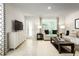 Living room featuring a neutral color palette and ample natural light at 2302 Incandescent Way, South Daytona, FL 32119