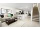 Open floorplan with living room, kitchen, and staircase at 2302 Incandescent Way, South Daytona, FL 32119