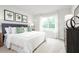 Spacious primary bedroom with large window and plush bedding at 281 Tahiti Rd, Lady Lake, FL 32159