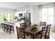 Bright dining room adjacent to kitchen with dark wood table and chairs at 281 Tahiti Rd, Lady Lake, FL 32159