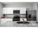 Modern kitchen with stainless steel appliances and granite countertops at 281 Tahiti Rd, Lady Lake, FL 32159