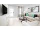 Light and airy living room with neutral colored furniture at 281 Tahiti Rd, Lady Lake, FL 32159