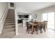 Kitchen and dining area with a wooden table and chairs, and access to the backyard at 334 Biltmore Blvd, Dundee, FL 33838