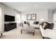 Bright living room boasts recessed lighting, neutral tones, and comfortable seating arrangements at 424 Hammock Oaks Blvd, Lady Lake, FL 32159