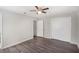 Spacious bedroom with vinyl flooring, ceiling fan, and closet at 1360 10Th Ne Ct, Winter Haven, FL 33881