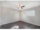 Bright bedroom features two windows and a ceiling fan at 1360 10Th Ne Ct, Winter Haven, FL 33881