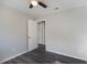 Comfortable bedroom with modern vinyl flooring, ceiling fan and open closet space at 1360 10Th Ne Ct, Winter Haven, FL 33881