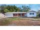Charming single-story home with brick accents, a well-maintained lawn, and a two-car garage at 1360 10Th Ne Ct, Winter Haven, FL 33881