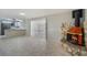 Bright living room featuring decorative fireplace and sliding door leading to kitchen at 1360 10Th Ne Ct, Winter Haven, FL 33881