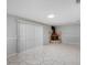 Open living space with tile floors, fireplace, and sliding glass door at 1360 10Th Ne Ct, Winter Haven, FL 33881