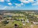 Beautiful aerial perspective featuring homes in a landscape with ponds, trees and waterways set against a clear blue sky at 5030 Alderman Rd, Lakeland, FL 33810