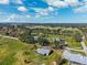 Beautiful aerial showcasing the property with green space, mature trees and waterway at 5030 Alderman Rd, Lakeland, FL 33810