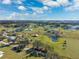 Aerial of the property with ponds and neighboring houses at 5030 Alderman Rd, Lakeland, FL 33810