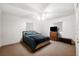 Comfortable bedroom with a bed, ceiling fan, and a dresser with a television at 5030 Alderman Rd, Lakeland, FL 33810