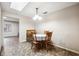 Cozy dining room with a charming table set for four, complemented by natural lighting and simple decor at 5030 Alderman Rd, Lakeland, FL 33810