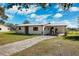 Front view of a ranch home with carport at 5030 Alderman Rd, Lakeland, FL 33810