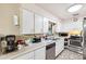 Functional kitchen featuring ample cabinetry, stainless steel appliances, and long countertop at 5030 Alderman Rd, Lakeland, FL 33810
