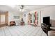 Bright living room with tile flooring, comfortable seating, and sliding glass doors at 5030 Alderman Rd, Lakeland, FL 33810