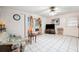 Cozy living room with tile flooring, comfortable seating, and a sliding glass door for easy outdoor access at 5030 Alderman Rd, Lakeland, FL 33810