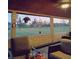 Relax on the covered porch with an outdoor view and ample seating at 5030 Alderman Rd, Lakeland, FL 33810