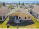 Aerial view of house showcasing backyard patio and surrounding landscape at 152 Travis Ln, Davenport, FL 33837