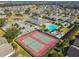 Aerial view of community amenities including tennis courts, pool, and clubhouse at 152 Travis Ln, Davenport, FL 33837