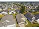 One-story house with grey roof and landscaped yard in a community at 152 Travis Ln, Davenport, FL 33837
