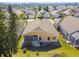 Aerial view of house showcasing backyard patio and surrounding landscape at 152 Travis Ln, Davenport, FL 33837
