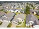 One-story house with grey roof and landscaped yard in a community at 152 Travis Ln, Davenport, FL 33837