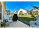 Spacious backyard with grassy area and neighboring houses visible at 152 Travis Ln, Davenport, FL 33837