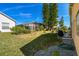 Landscaped backyard with patio, providing ample outdoor space at 152 Travis Ln, Davenport, FL 33837