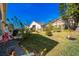 Backyard with patio, landscaping and a spacious lawn at 152 Travis Ln, Davenport, FL 33837
