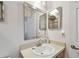Bathroom boasts a vanity with sink and large mirror at 152 Travis Ln, Davenport, FL 33837