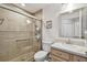 Updated bathroom features a walk-in shower, toilet and vanity with granite countertop at 152 Travis Ln, Davenport, FL 33837