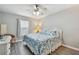 Bedroom with king-size bed and white wicker furniture at 152 Travis Ln, Davenport, FL 33837