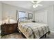 Bedroom with full-size bed, ceiling fan, and dark dresser at 152 Travis Ln, Davenport, FL 33837