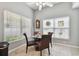 Bright breakfast nook with glass table and wicker chairs at 152 Travis Ln, Davenport, FL 33837