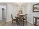 Bright dining area with table and four chairs at 152 Travis Ln, Davenport, FL 33837