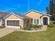 Well-maintained home with landscaped yard and garage at 152 Travis Ln, Davenport, FL 33837