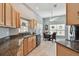 Open kitchen with granite countertops and breakfast nook at 152 Travis Ln, Davenport, FL 33837