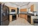 Modern kitchen featuring granite counters and stainless steel appliances at 152 Travis Ln, Davenport, FL 33837