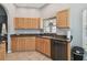 Kitchen with granite countertops and wood cabinets at 152 Travis Ln, Davenport, FL 33837