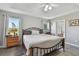Bright main bedroom features a king bed and access to a patio at 152 Travis Ln, Davenport, FL 33837